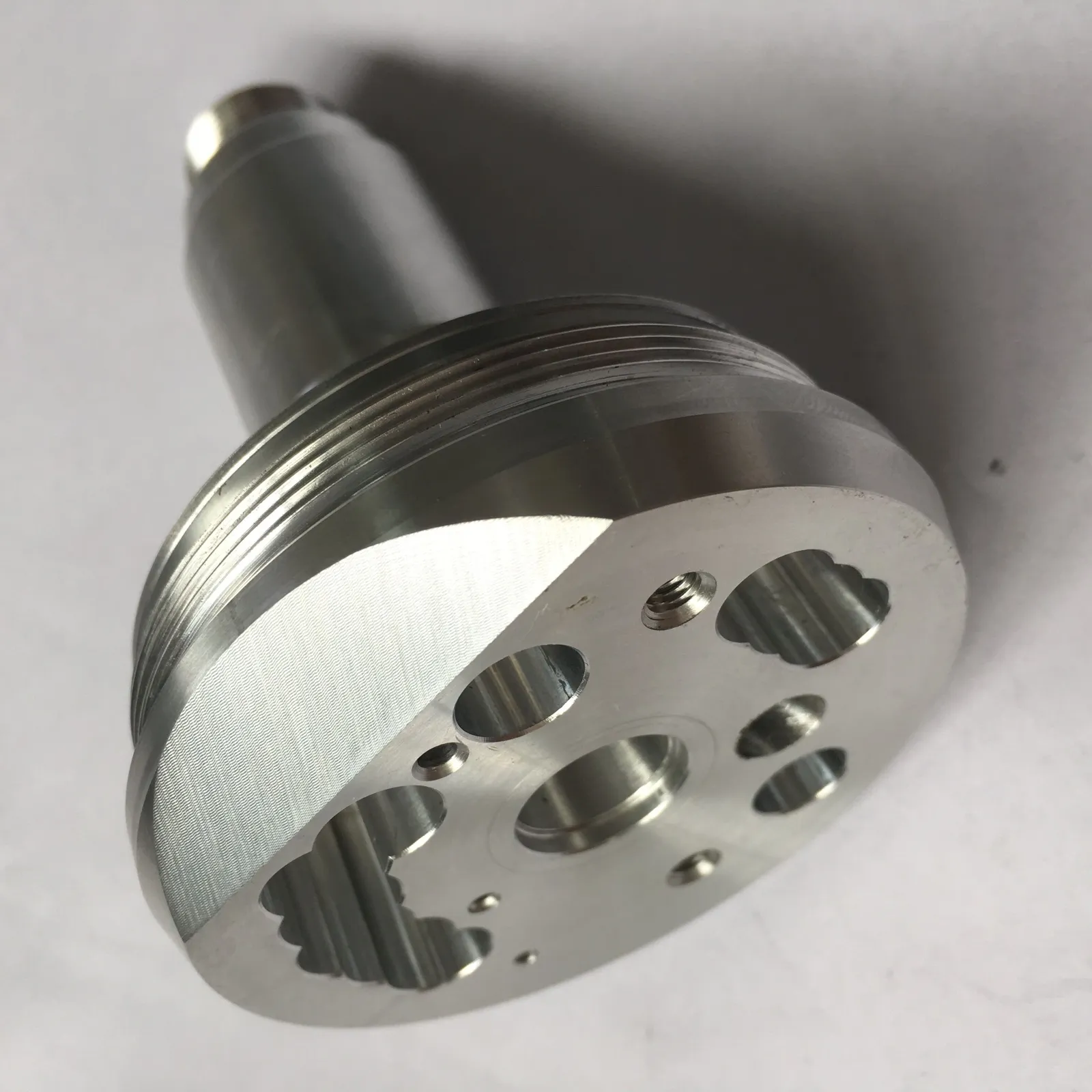Precision machined flange with holes and threads